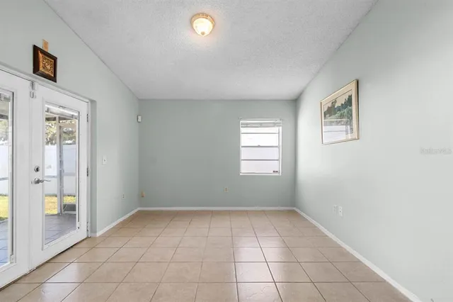 a view of a room that has a sink and cabinets