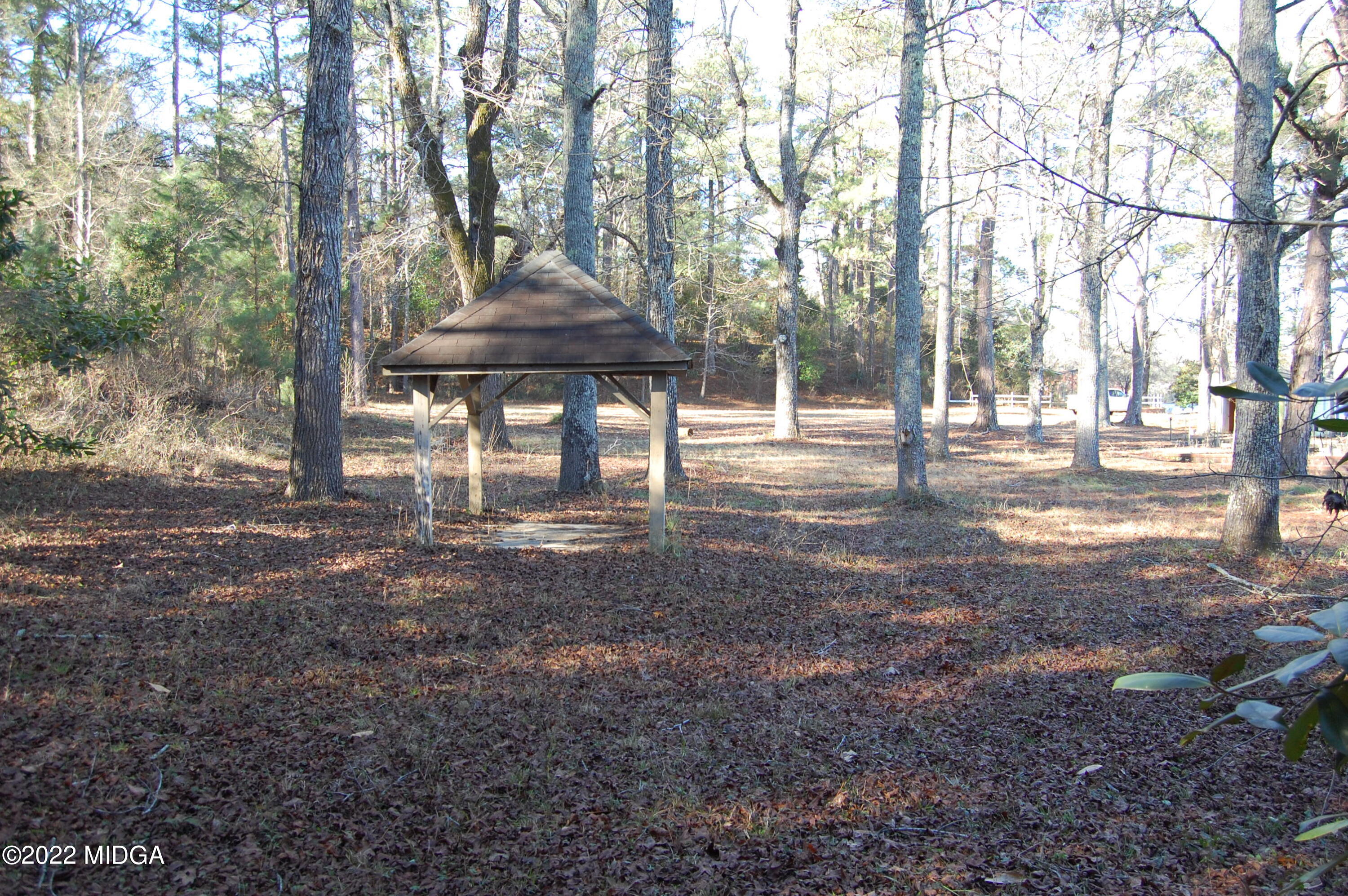 2802 Jeffersonville Road Macon, GA 31217 - Photo 24 of 32 a view of a backyard with large trees