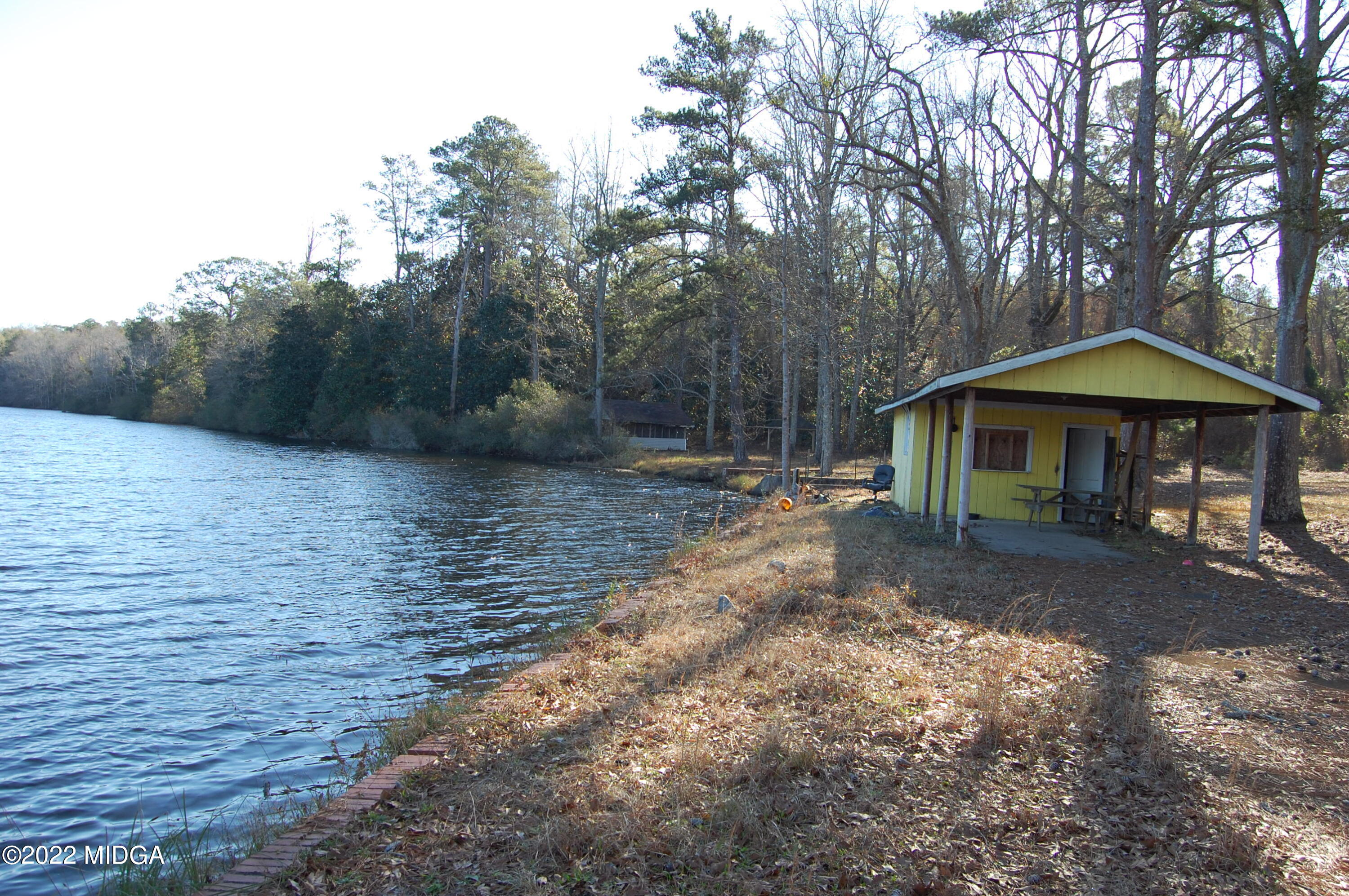 2802 Jeffersonville Road Macon, GA 31217 - Photo 8 of 32 a backyard of a house with table and chairs