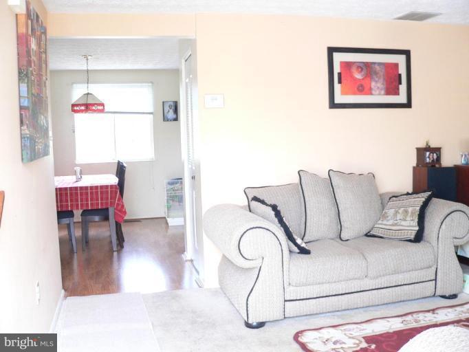 1417 Farmcrest Way Silver Spring, MD 20905 - Photo 5 of 18 passage from living rm. to dining area
