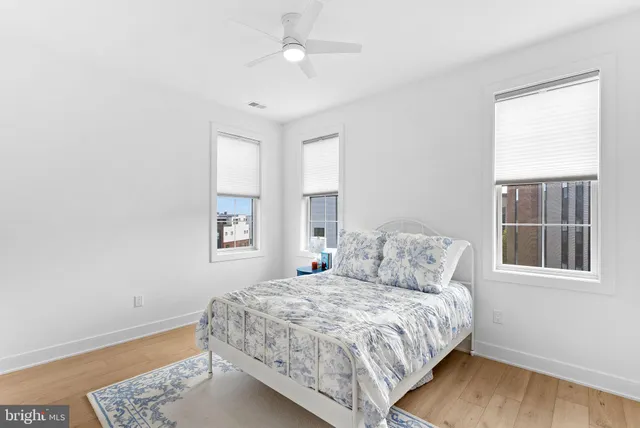 a bedroom with a large bed and a window