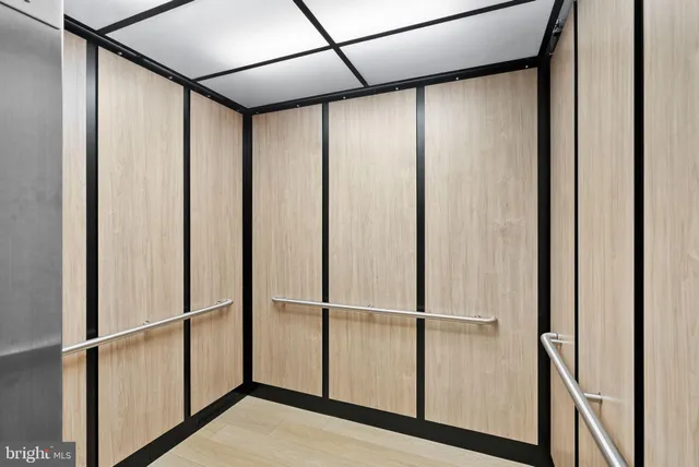 a kitchen with stainless steel appliances granite countertop a stove top oven a refrigerator and island