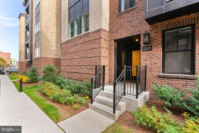 a view of swimming pool with outdoor seating and city view