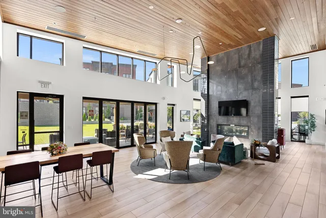 a view of a living room kitchen and a sink