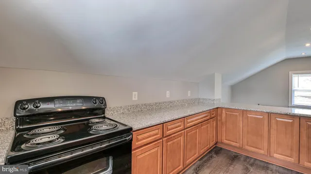 a kitchen with a stove top oven