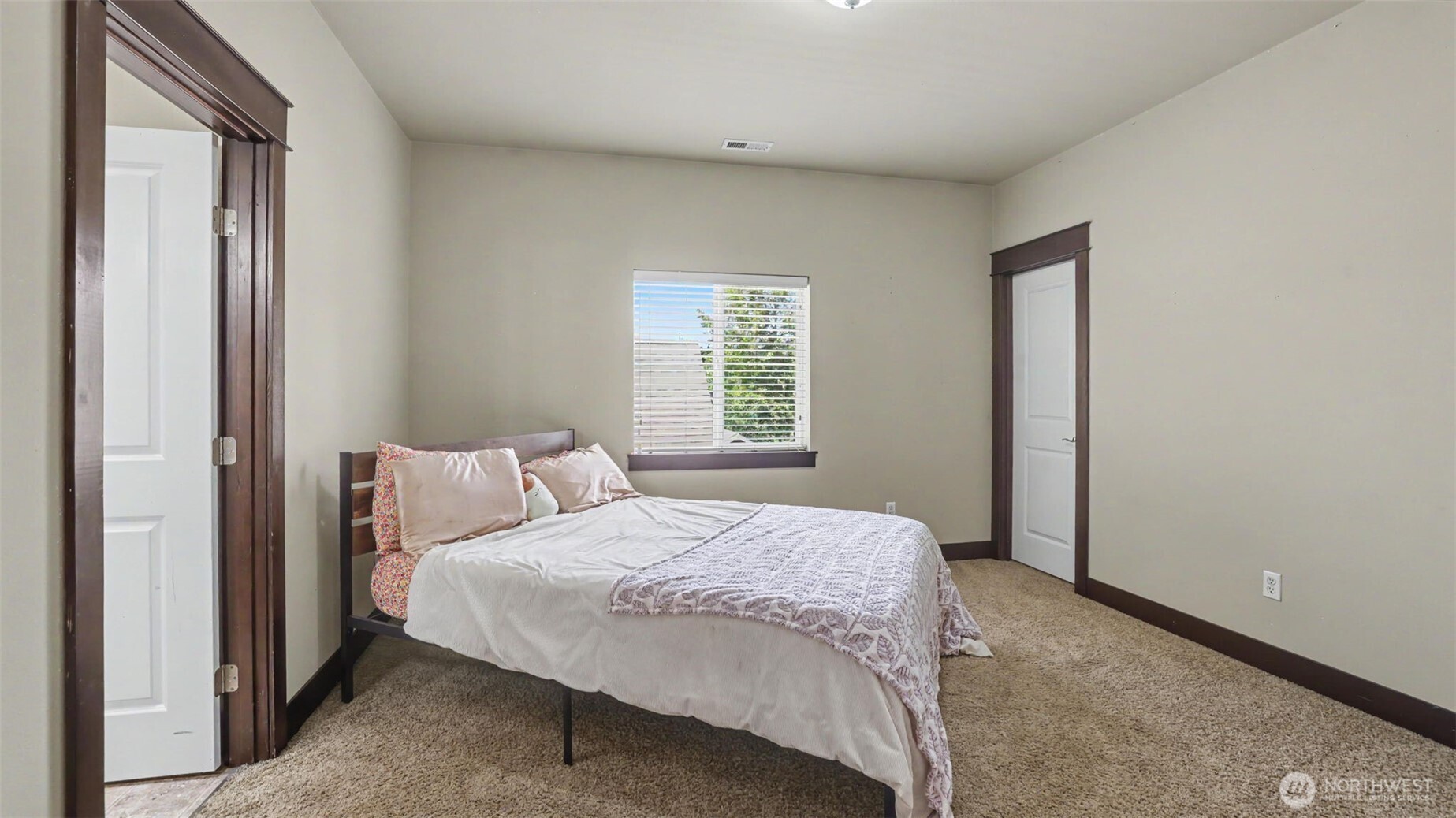 1357 Elma Place Northeast Renton, WA 98059 - Photo 26 of 40 a bedroom with a bed and a window
