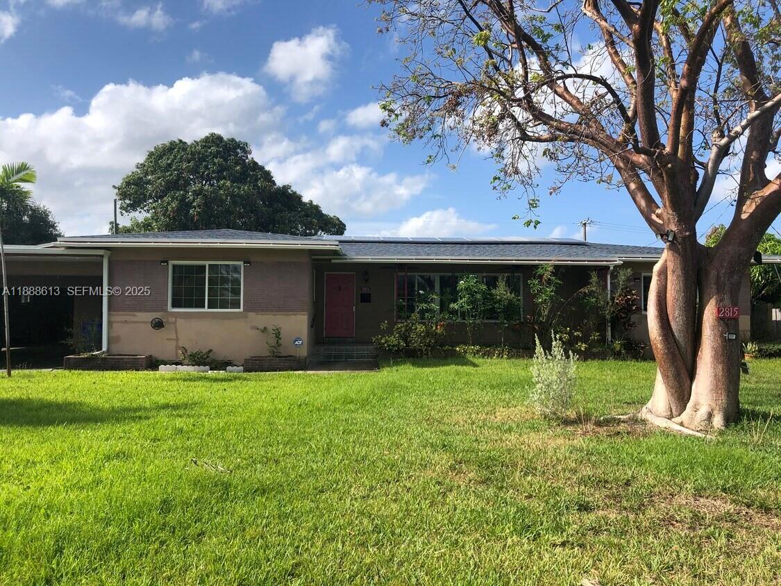 2815 Jackson Street Hollywood, FL 33020 - Photo 3 of 7 a view of a house with a backyard