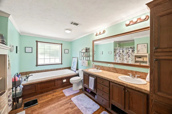 a bathroom with a bathtub and shower