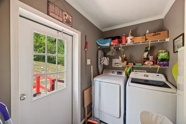 a view of a livingroom with furniture and workspace