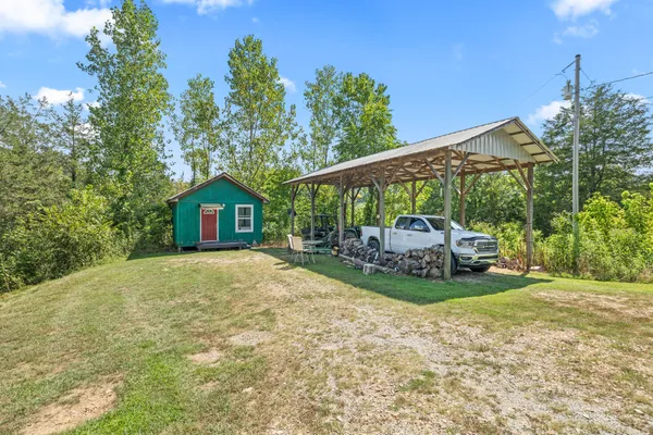 a view of a tiny house with a yard