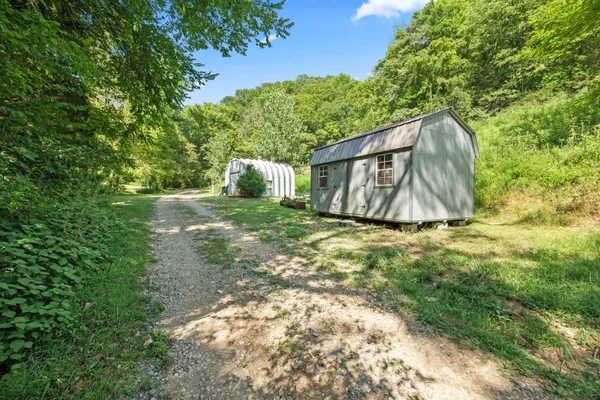 a backyard of a house with lots of green space