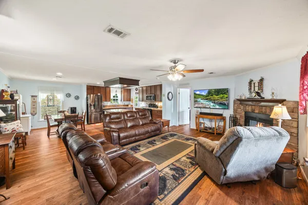 a large kitchen with kitchen island a sink stove and refrigerator