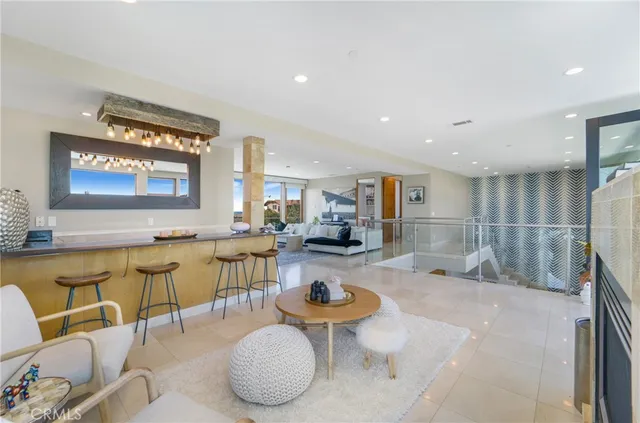 a kitchen with stainless steel appliances granite countertop a sink and a refrigerator