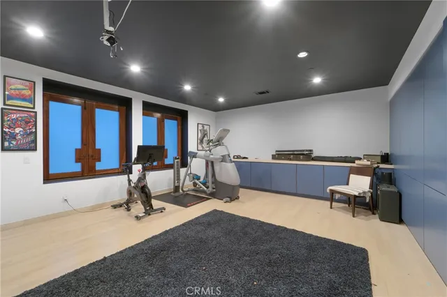 a living room with lots of furniture and a large window