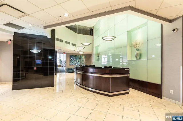 a view of a room with a kitchen