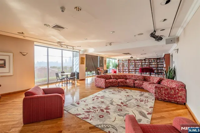 a view of a tennis court with a large bridge