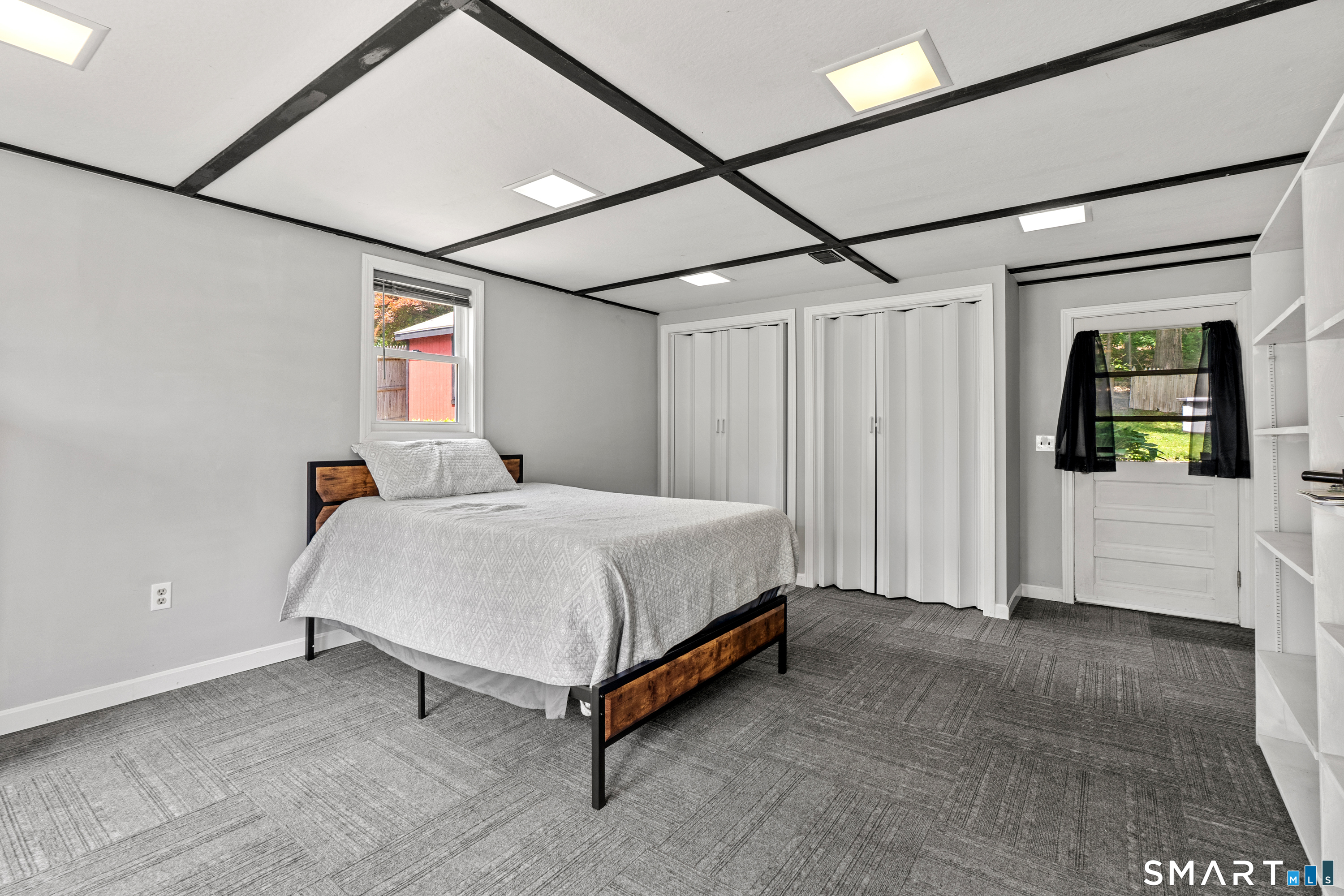 107 Round Hill Road Wethersfield, CT 06109 - Photo 21 of 40 a spacious bedroom with a bed and a table