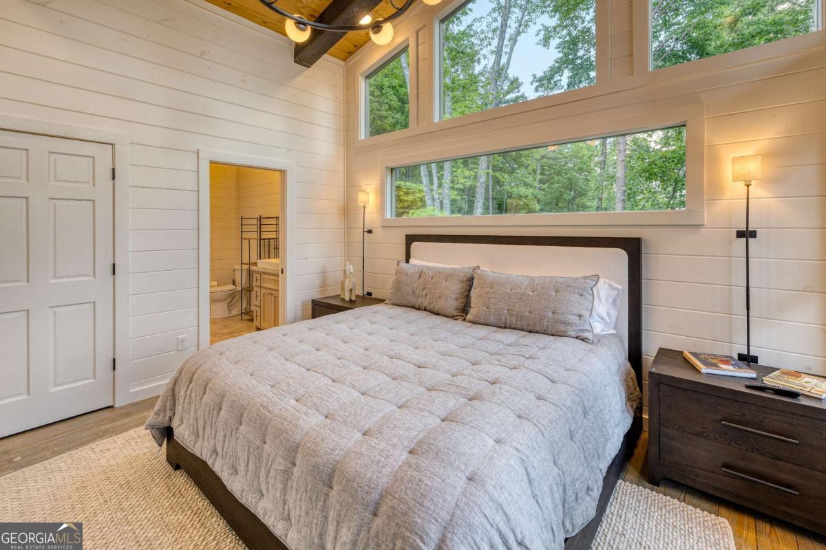 281 Raintree Bend Blue Ridge, GA 30513 - Photo 13 of 56 a bedroom with a bed and window