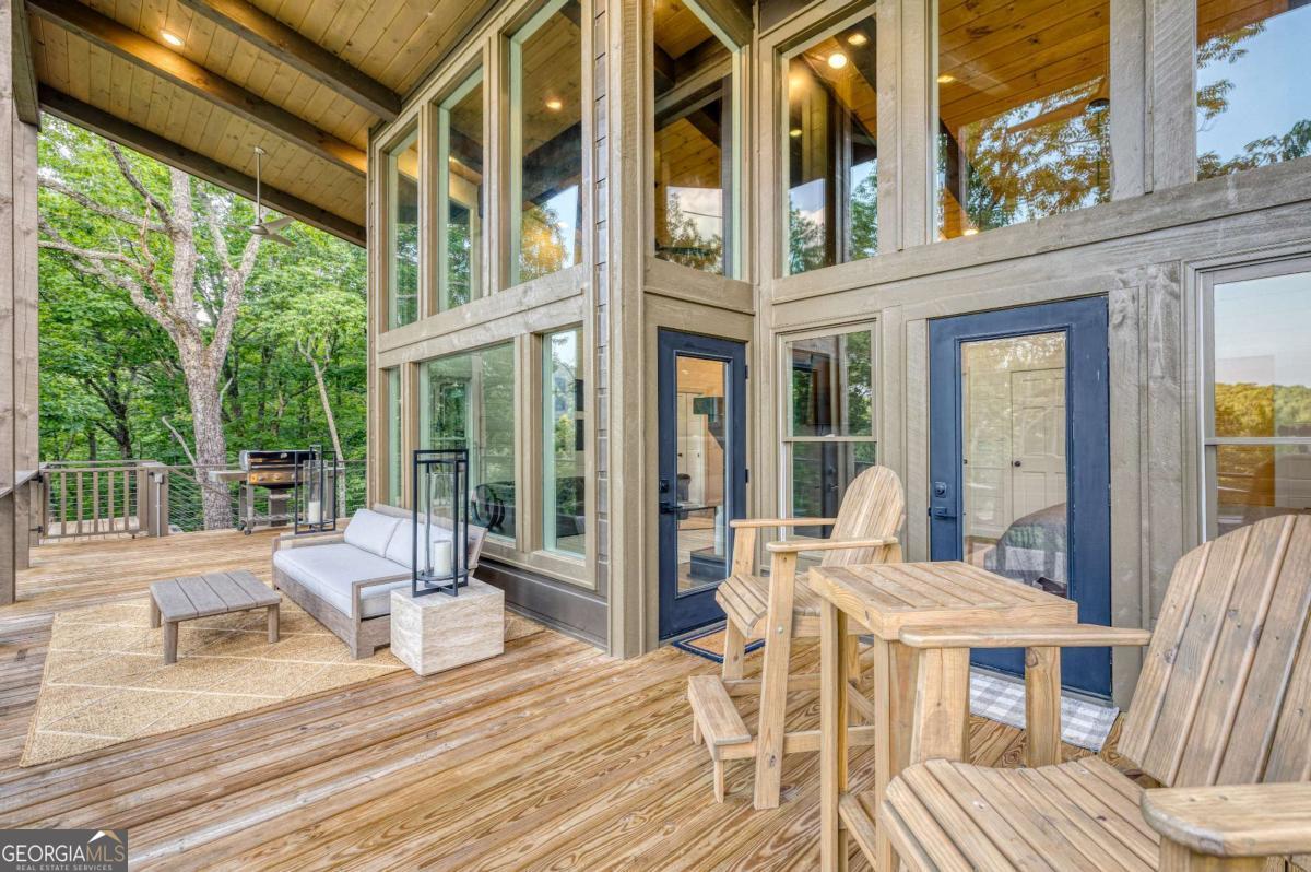 281 Raintree Bend Blue Ridge, GA 30513 - Photo 21 of 56 a view of a patio with couches table and chairs