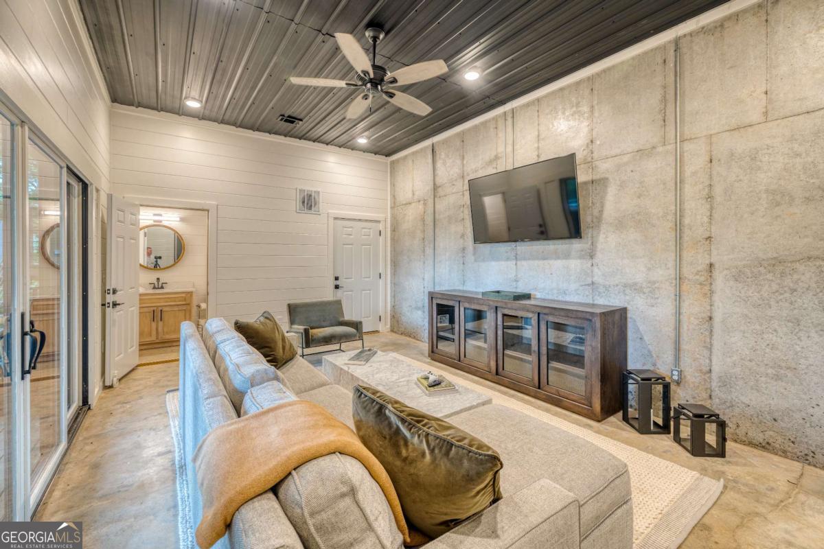 281 Raintree Bend Blue Ridge, GA 30513 - Photo 35 of 56 a bed room with a bed and a television