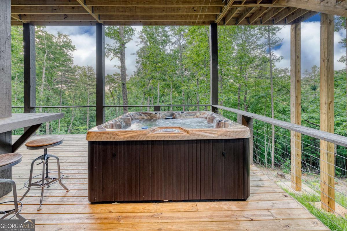 281 Raintree Bend Blue Ridge, GA 30513 - Photo 40 of 56 a view of a patio with wooden floor and outdoor seating