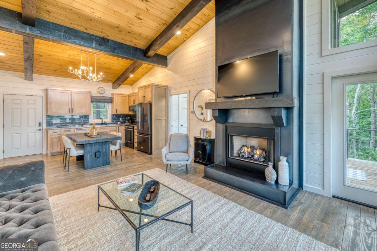281 Raintree Bend Blue Ridge, GA 30513 - Photo 7 of 56 a living room with furniture and a fireplace