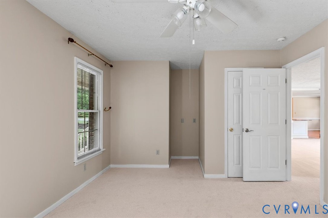 1437 Palmore Road Powhatan, VA 23139 - Photo 24 of 60 Neutral-toned room featuring a single window with