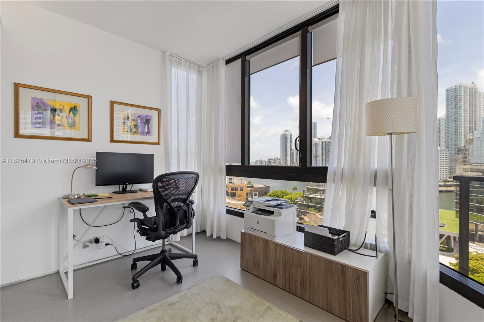520 Brickell Key Drive, Unit A1421 Miami, FL 33131 - Photo 11 of 34 a work room with furniture and a window