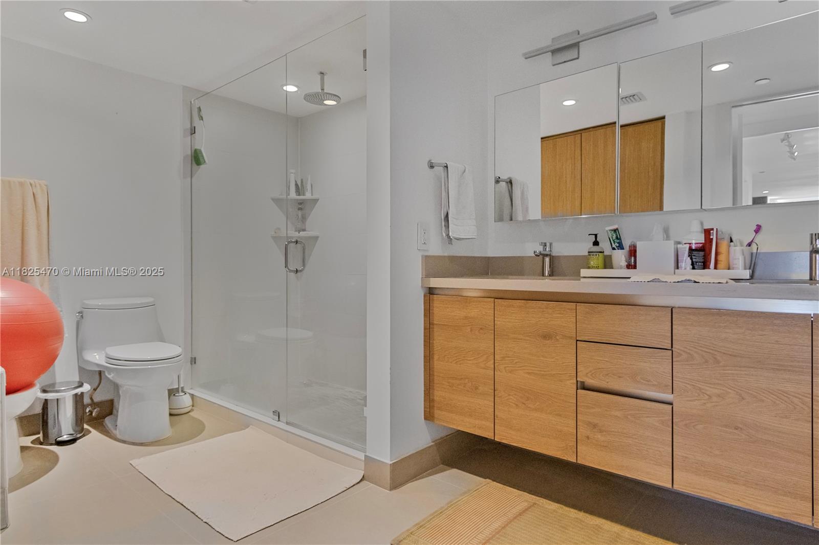 520 Brickell Key Drive, Unit A1421 Miami, FL 33131 - Photo 17 of 34 a bathroom with a sink a toilet and shower