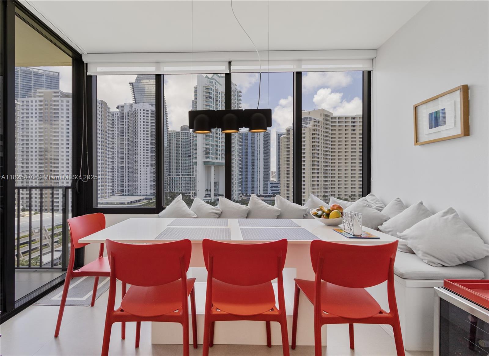 520 Brickell Key Drive, Unit A1421 Miami, FL 33131 - Photo 3 of 34 a dining room with furniture and window