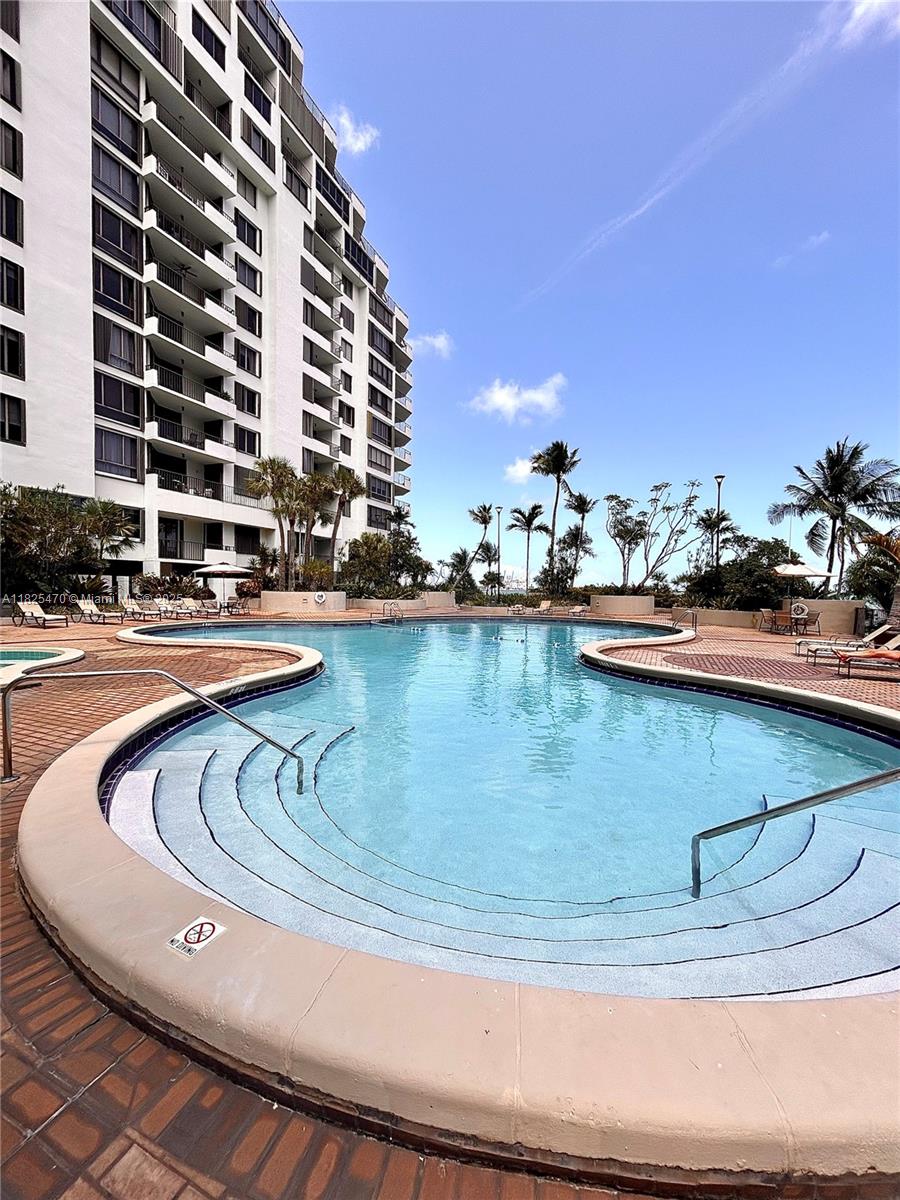 520 Brickell Key Drive, Unit A1421 Miami, FL 33131 - Photo 34 of 34 a view of a swimming pool with outdoor seating