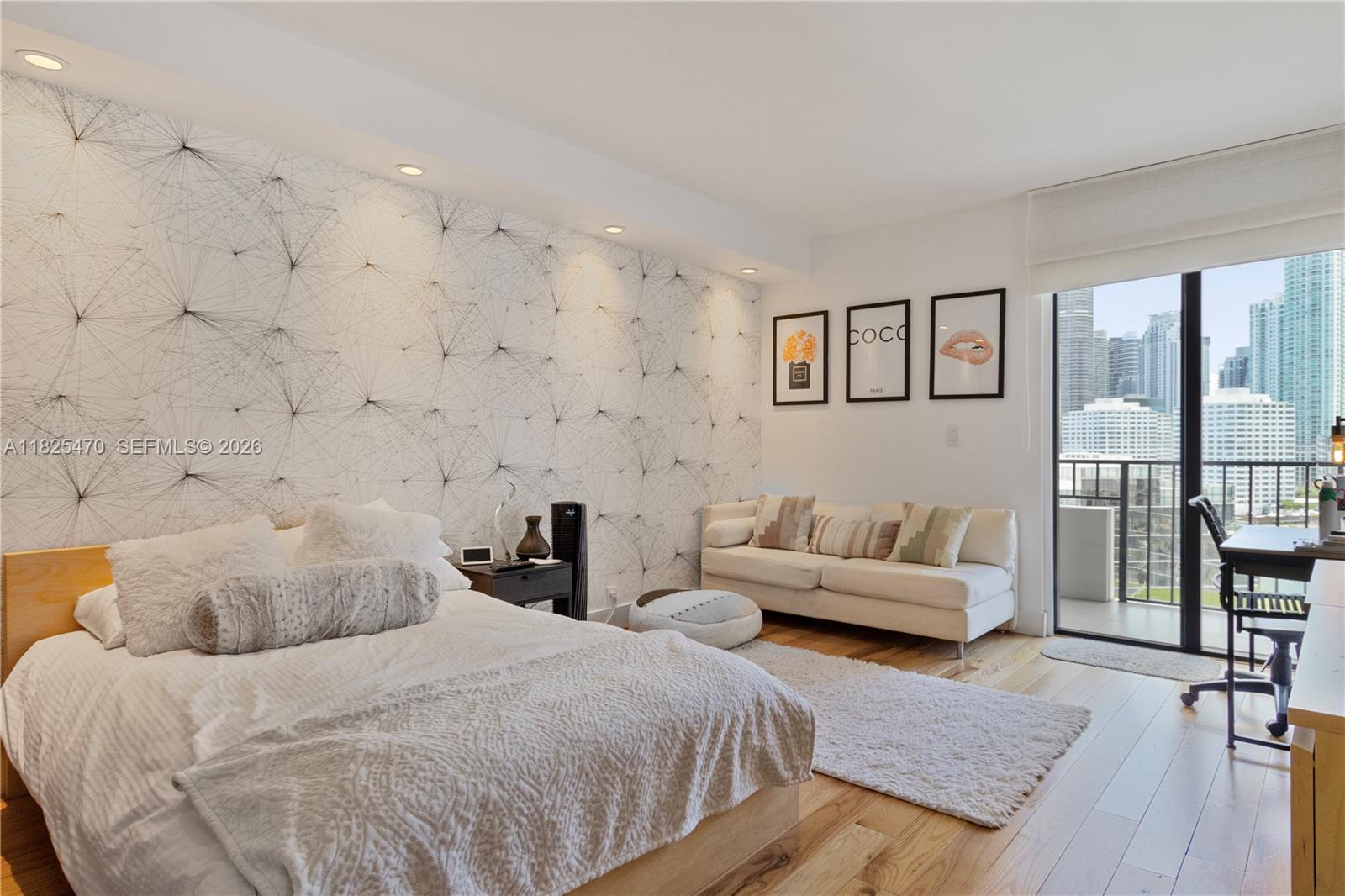 520 Brickell Key Drive, Unit A1421 Miami, FL 33131 - Photo 10 of 16 a spacious bedroom with a bed and a couch