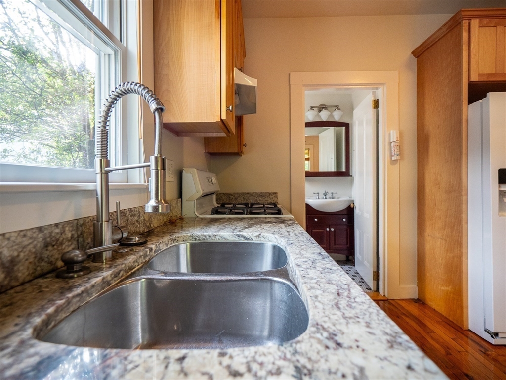 12 Adella Place Boston, MA 02134 - Photo 7 of 36 a view closed with a granite countertop sink