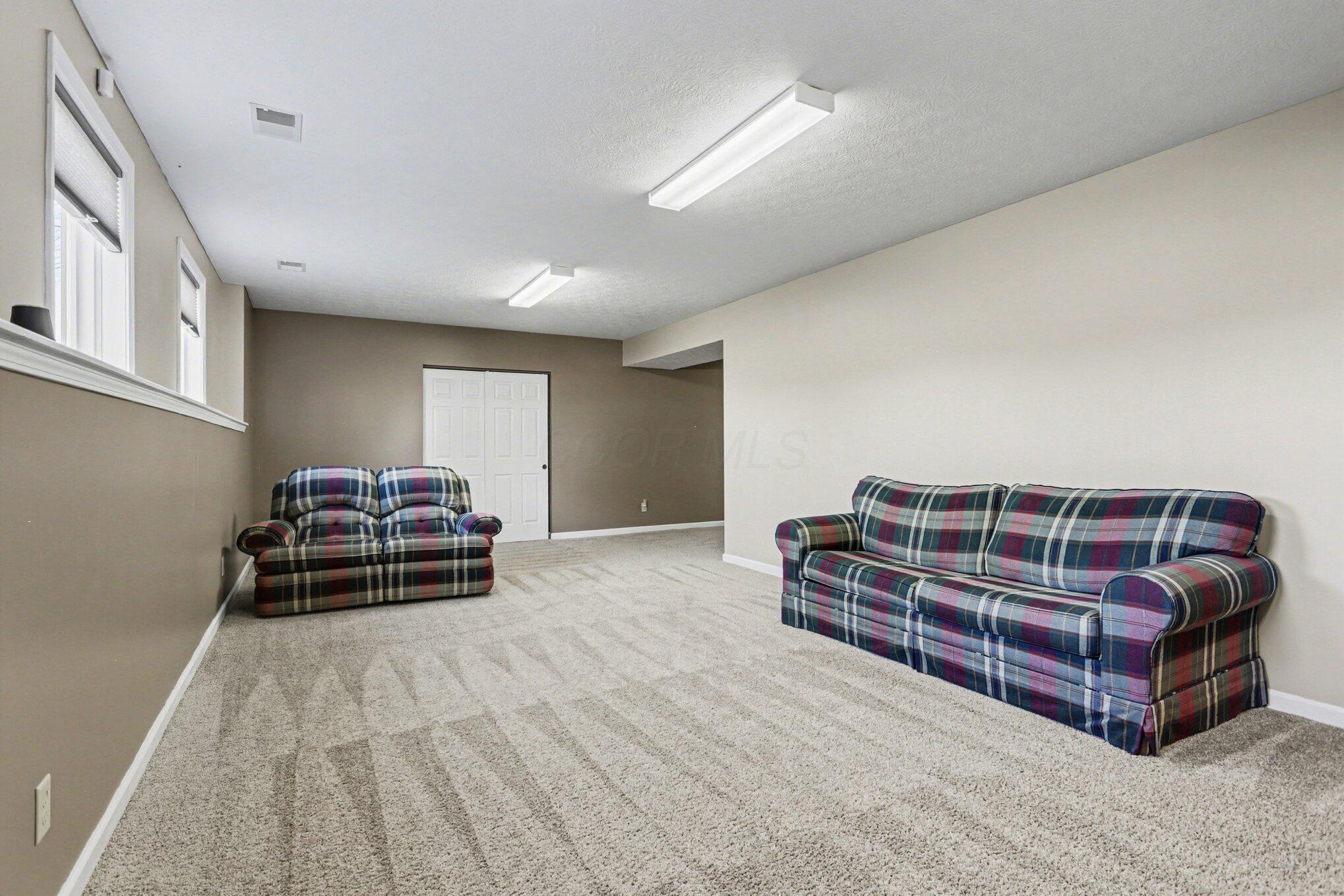 1855 Spring Valley Road London, OH 43140 - Photo 27 of 54 Another family room view looking towards the entrance from the stairs.