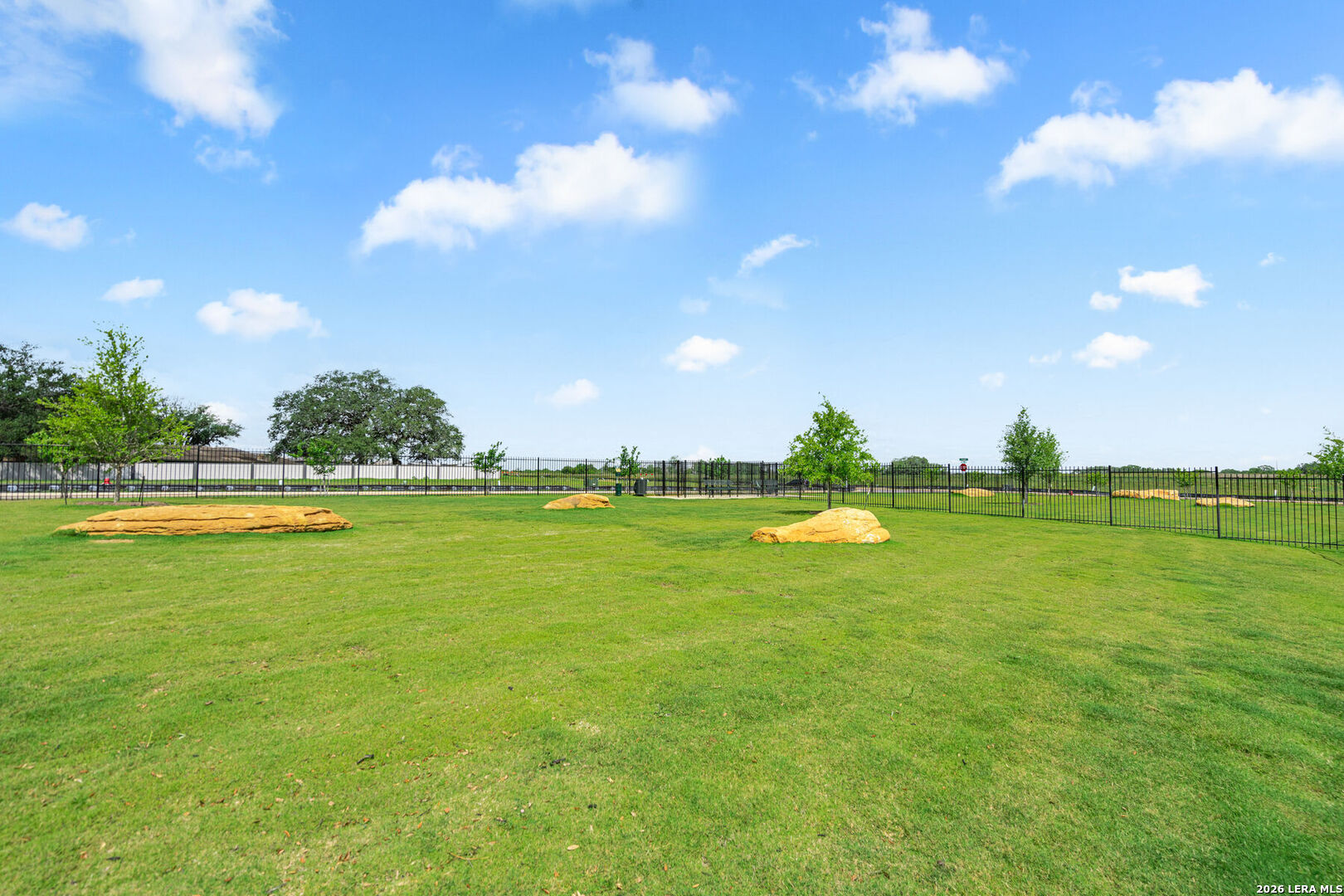 16189 Farmer Lytle, TX 78052 - Photo 27 of 28 a view of a golf course with a lake