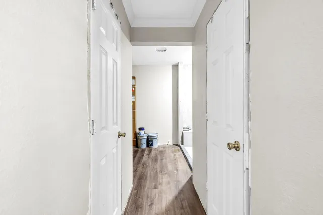 a bedroom with bed and a chandelier