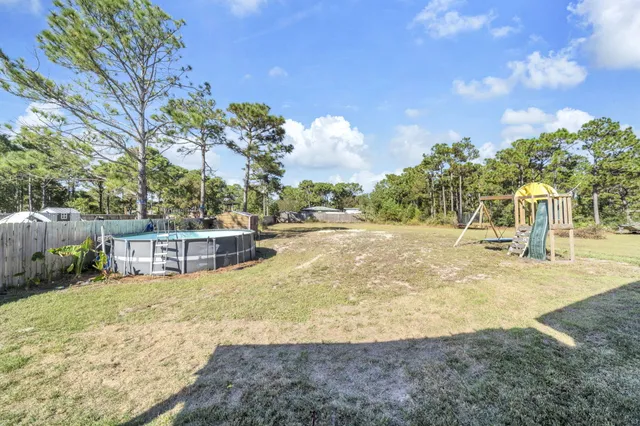 a view of a patio with wooden floor