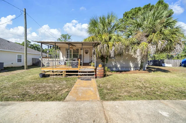 a view of a yard with swimming pool