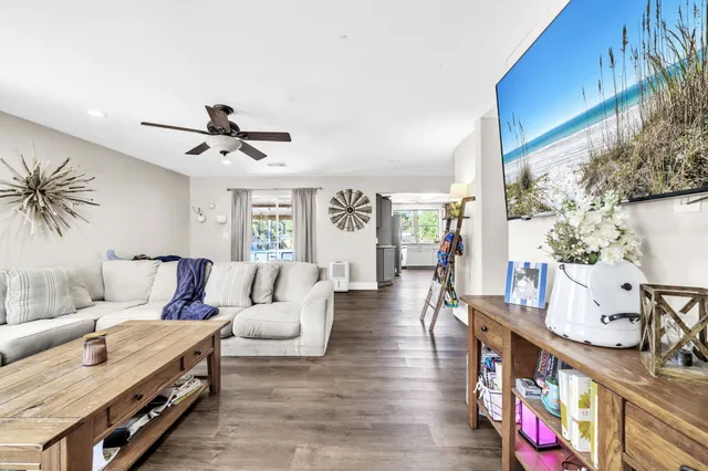 a view of a house with backyard porch and sitting area
