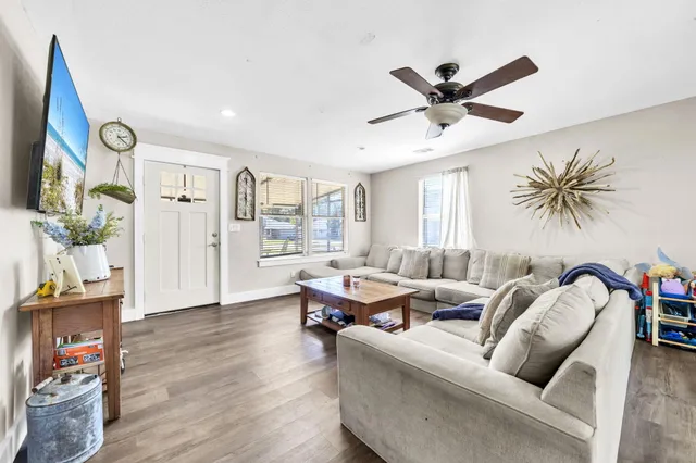 a living room with furniture and a large window
