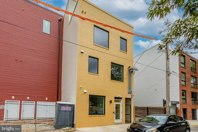 a front view of a building with parking space