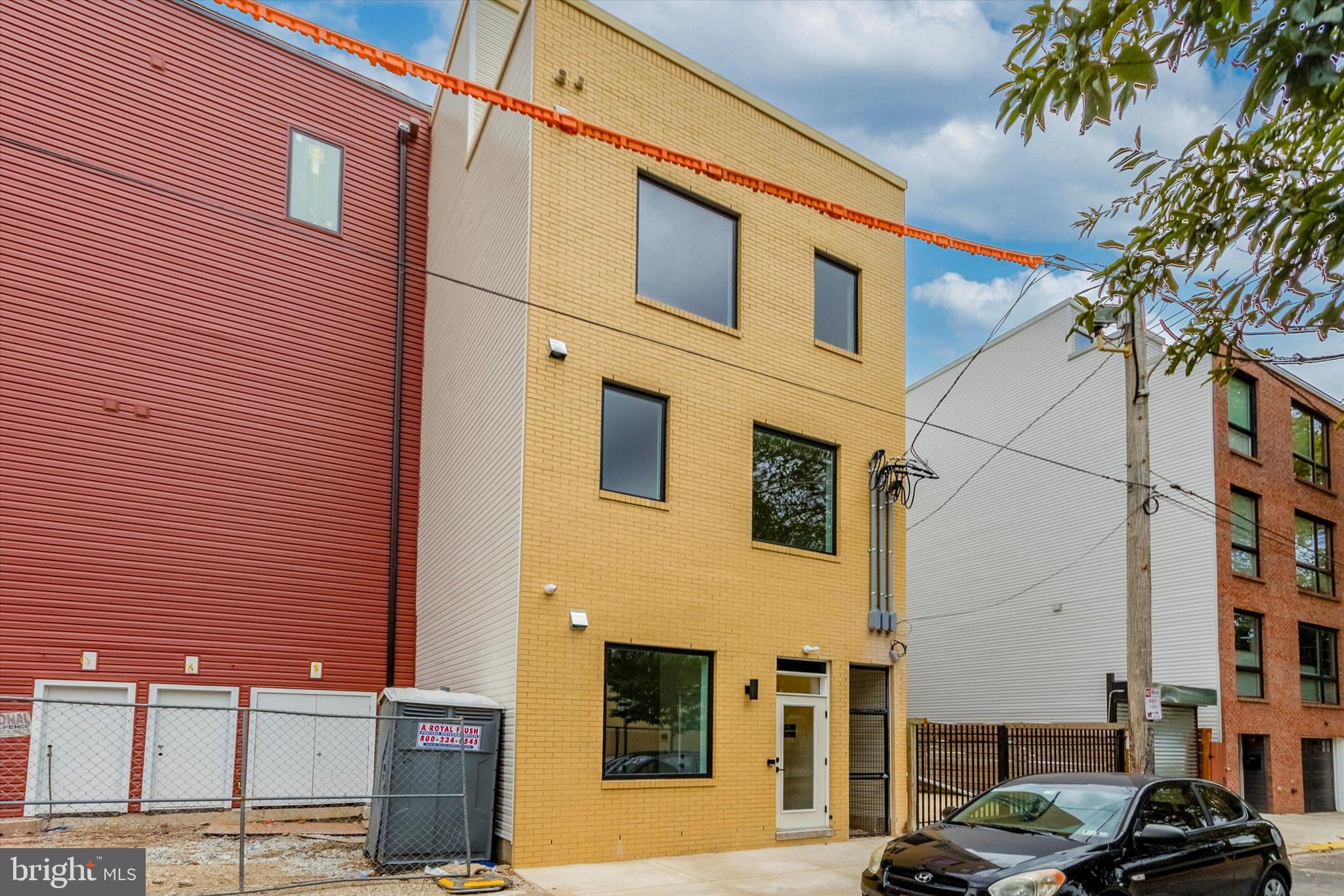 1826 Frankford Avenue, Unit 3 Philadelphia, PA 19125 - Photo 7 of 18 a front view of a building with parking space