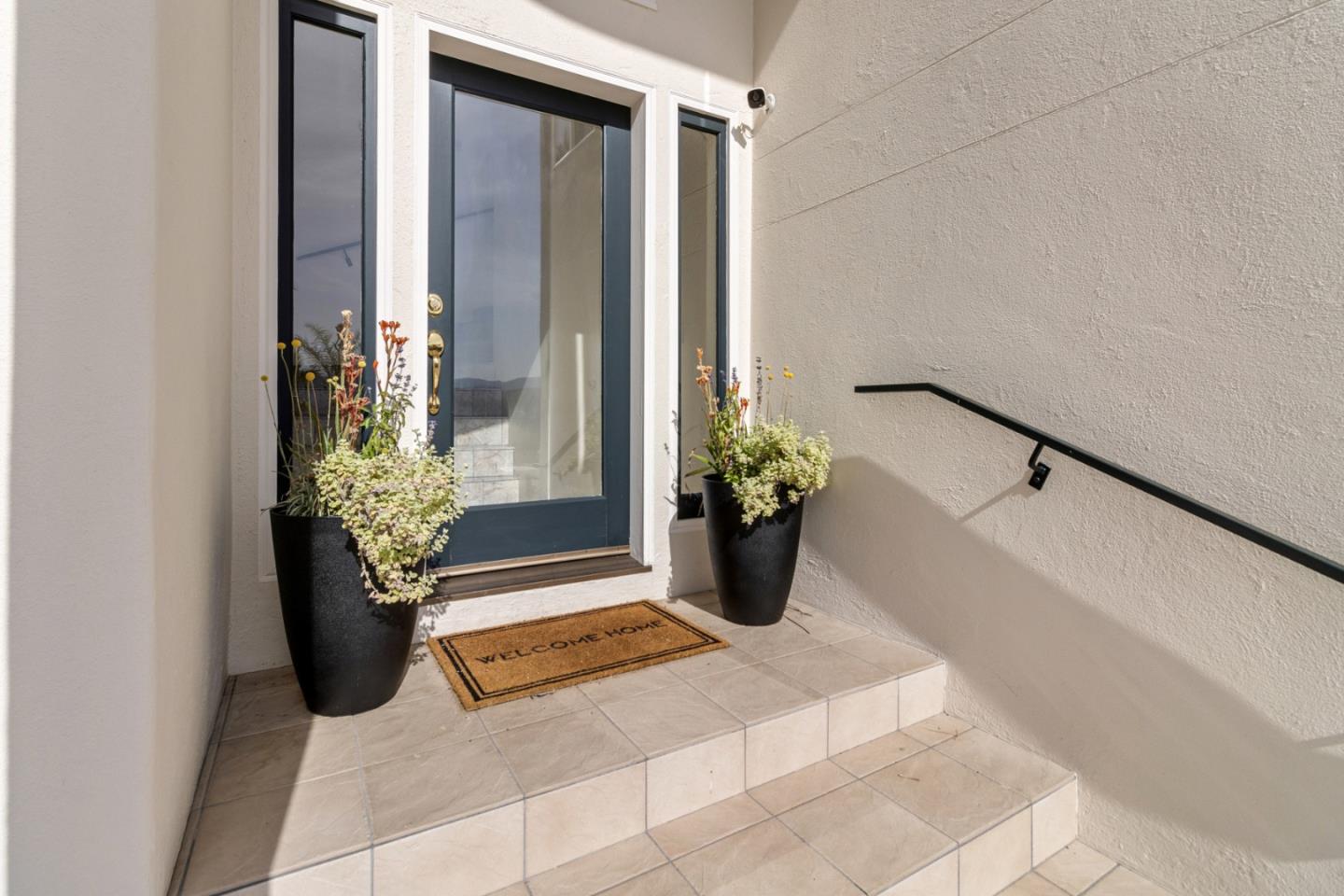 320 El Caminito Road Carmel Valley, CA 93924 - Photo 6 of 62 a view of a potted plant sitting in front of a door