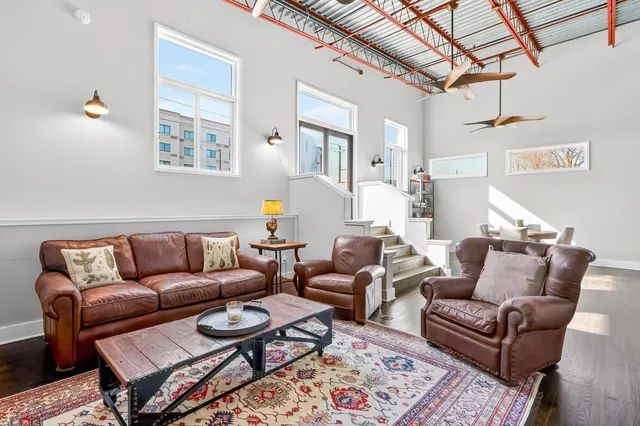 a living room with furniture and a rug