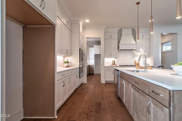 a bathroom with a double vanity sink mirror and shower