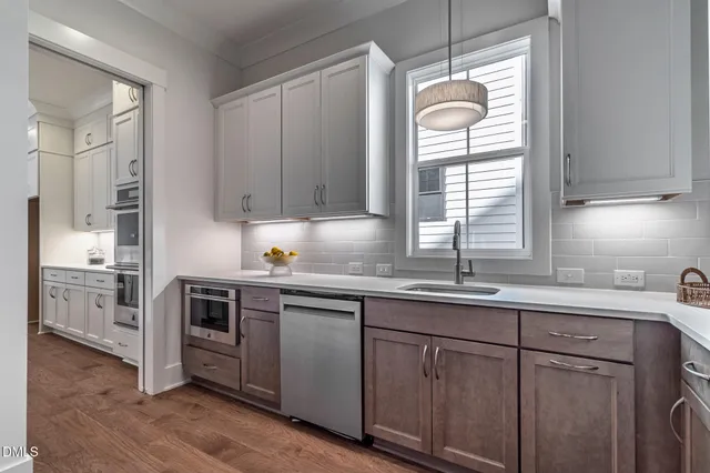 a bathroom with a double vanity sink mirror and