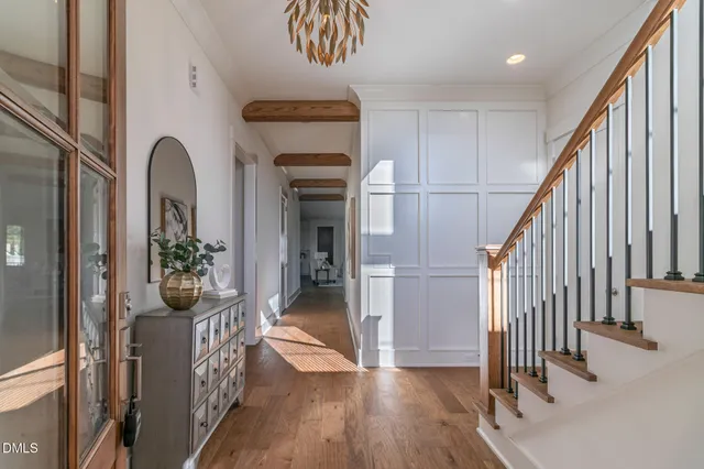 a view of an entryway with wooden floor