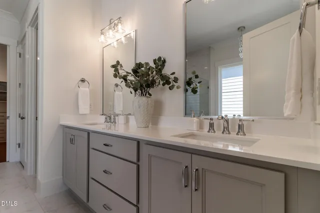 an empty room with a windows and ceiling fan