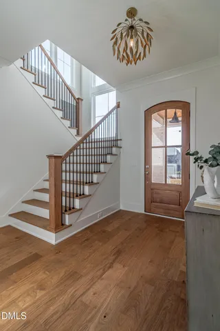 a kitchen with kitchen island granite countertop a sink a counter space and stainless steel appliances