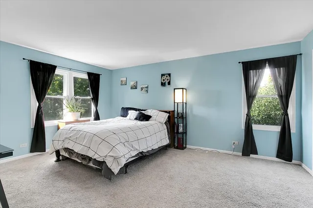 a bathroom with a granite countertop sink a toilet and a mirror